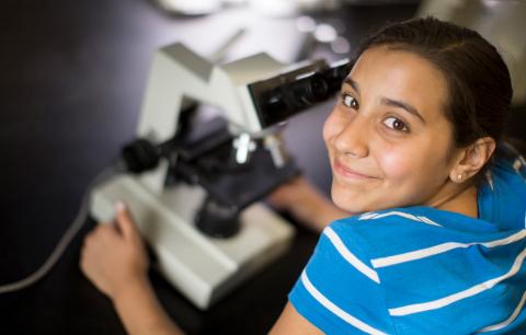 Girl with microscope