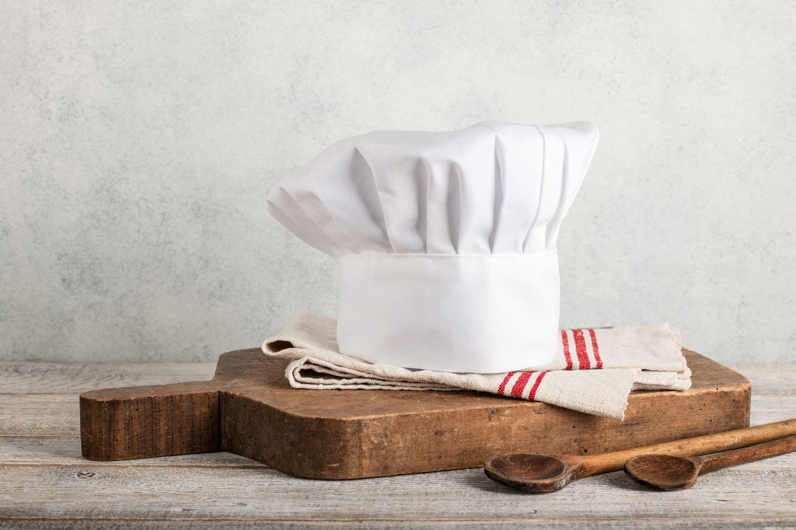 Chef's hat on cutting board