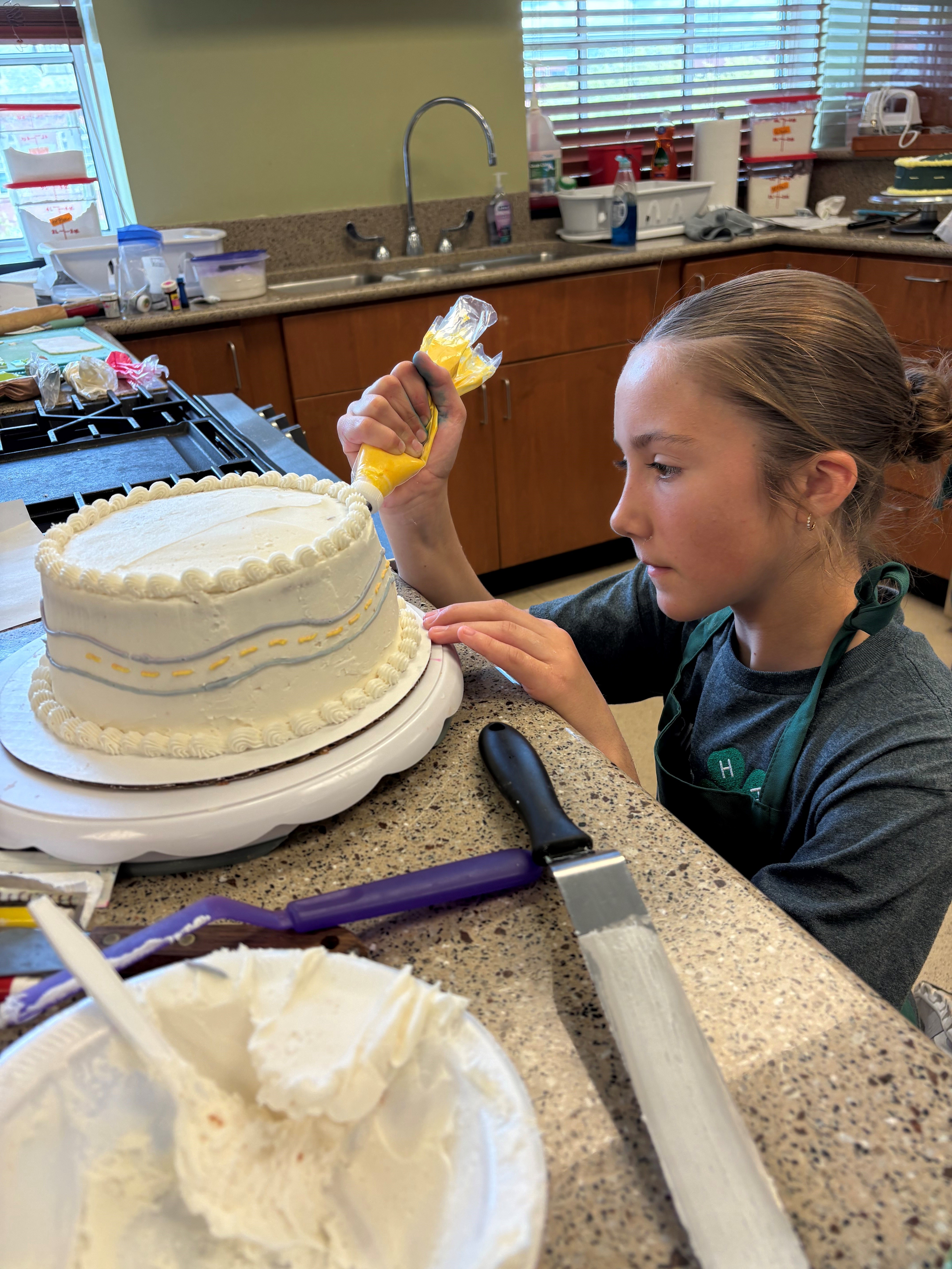 Youth decorating a cake