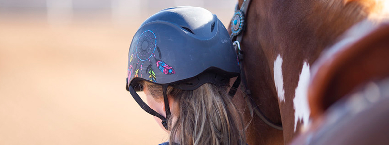 Girl leading her horse