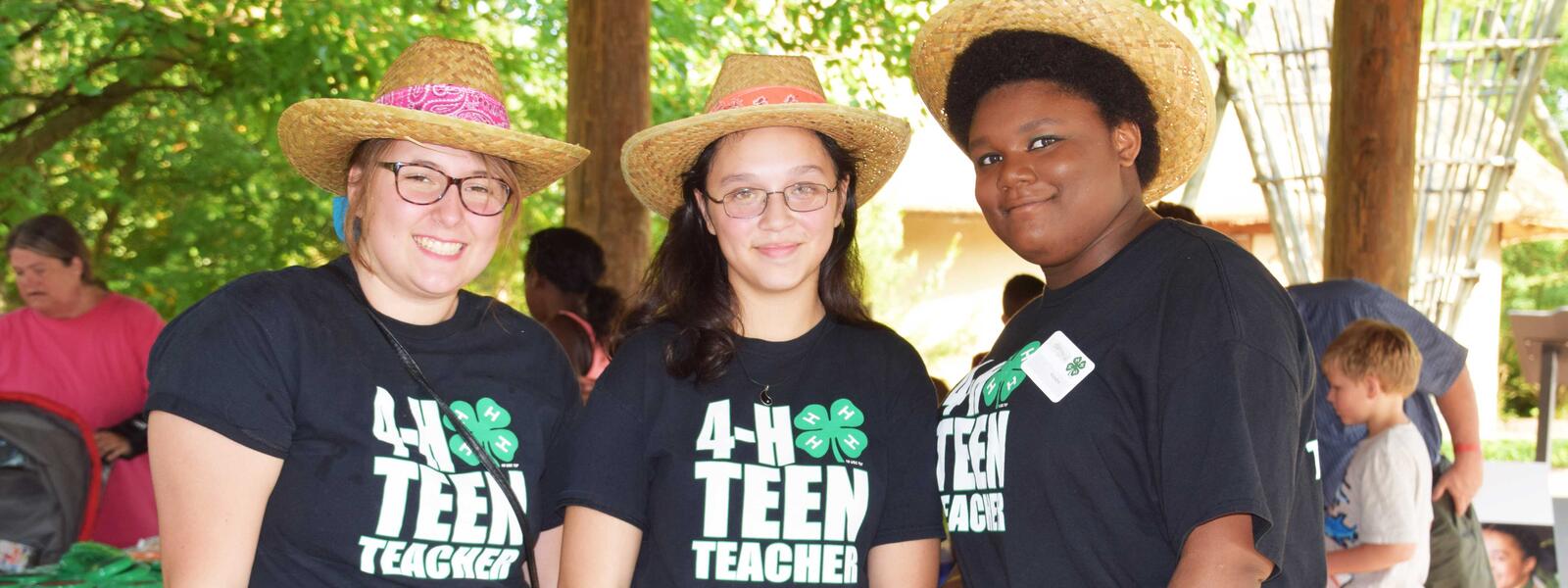 Teen girls wearing 4-H gear