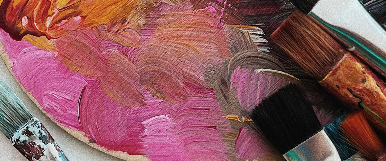 close up of a paint pallete and brushes