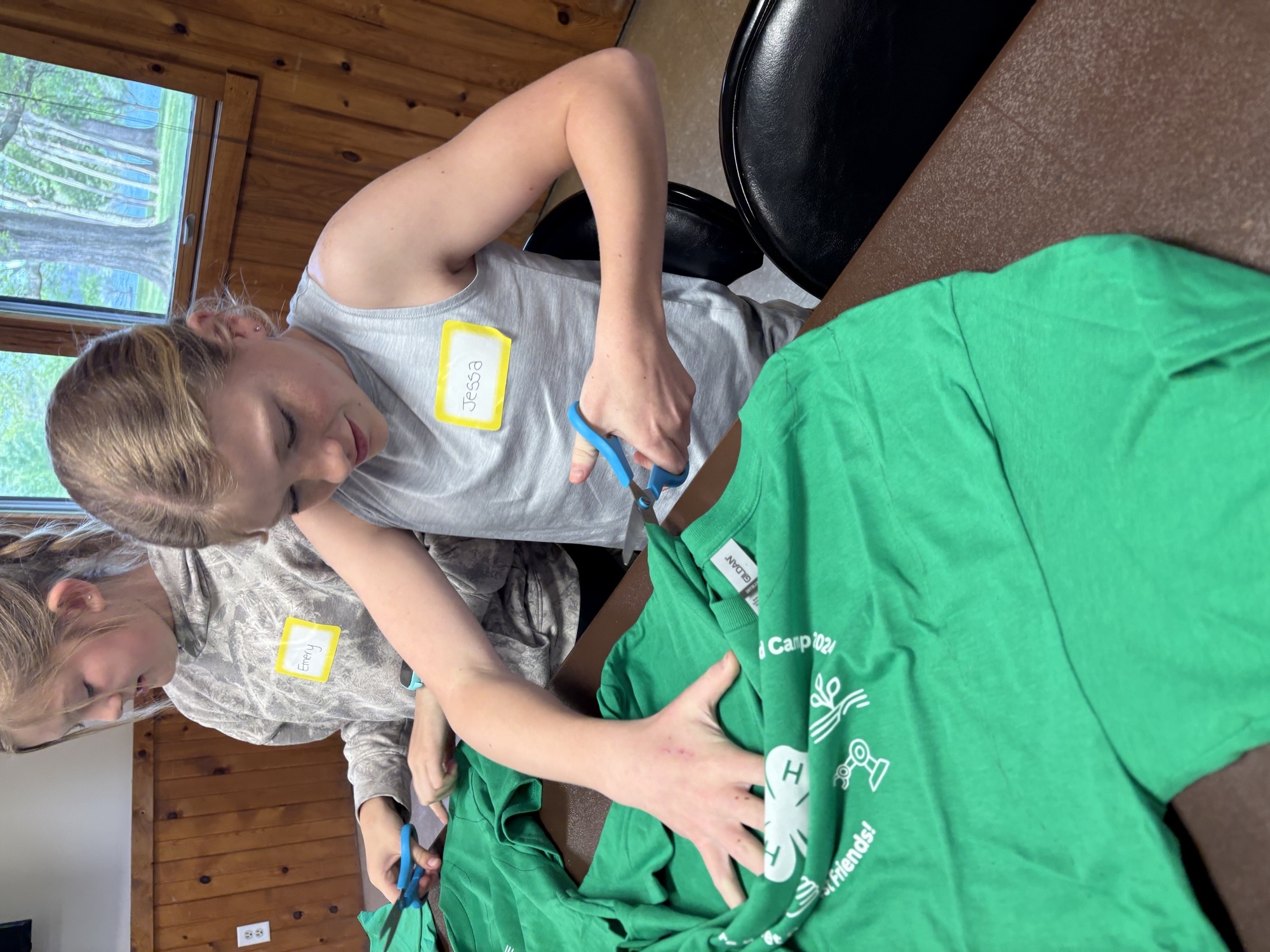 Youth cutting t-shirt for art project