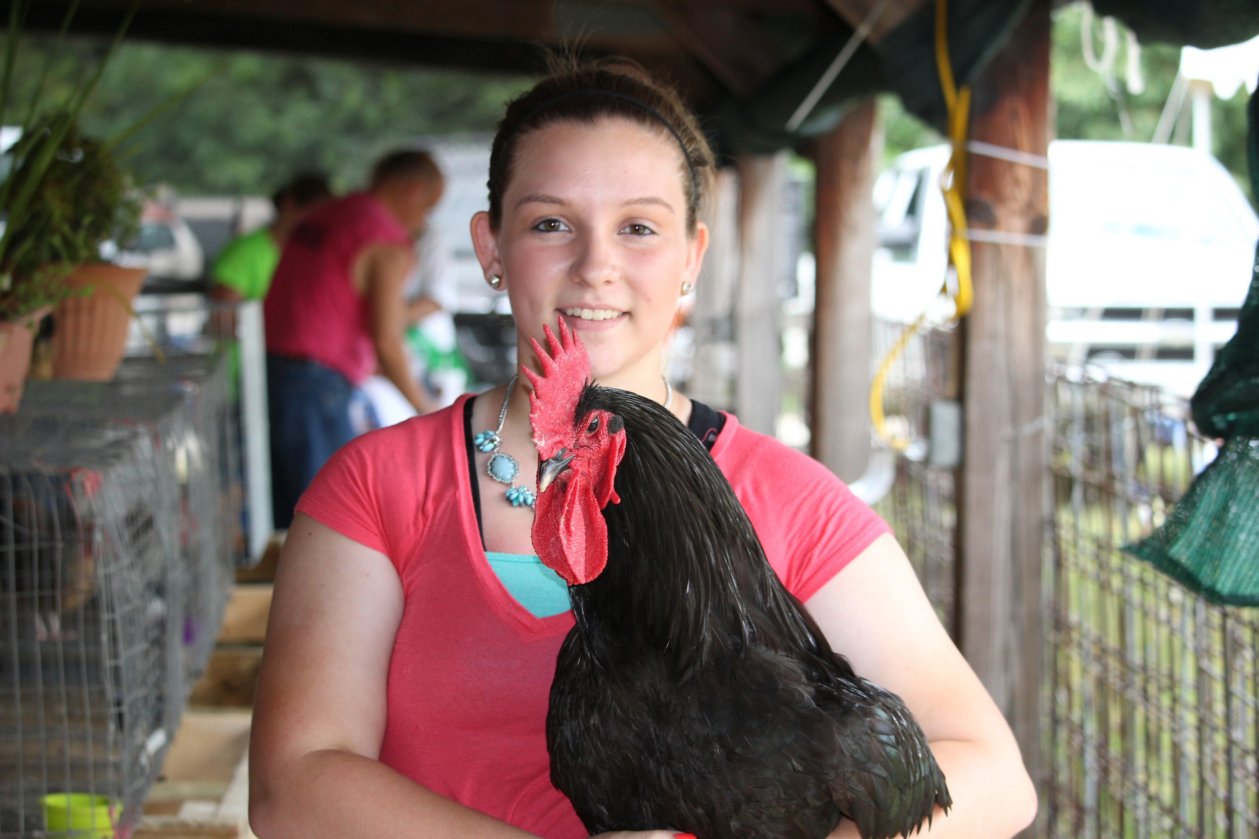 Girl holding chicken