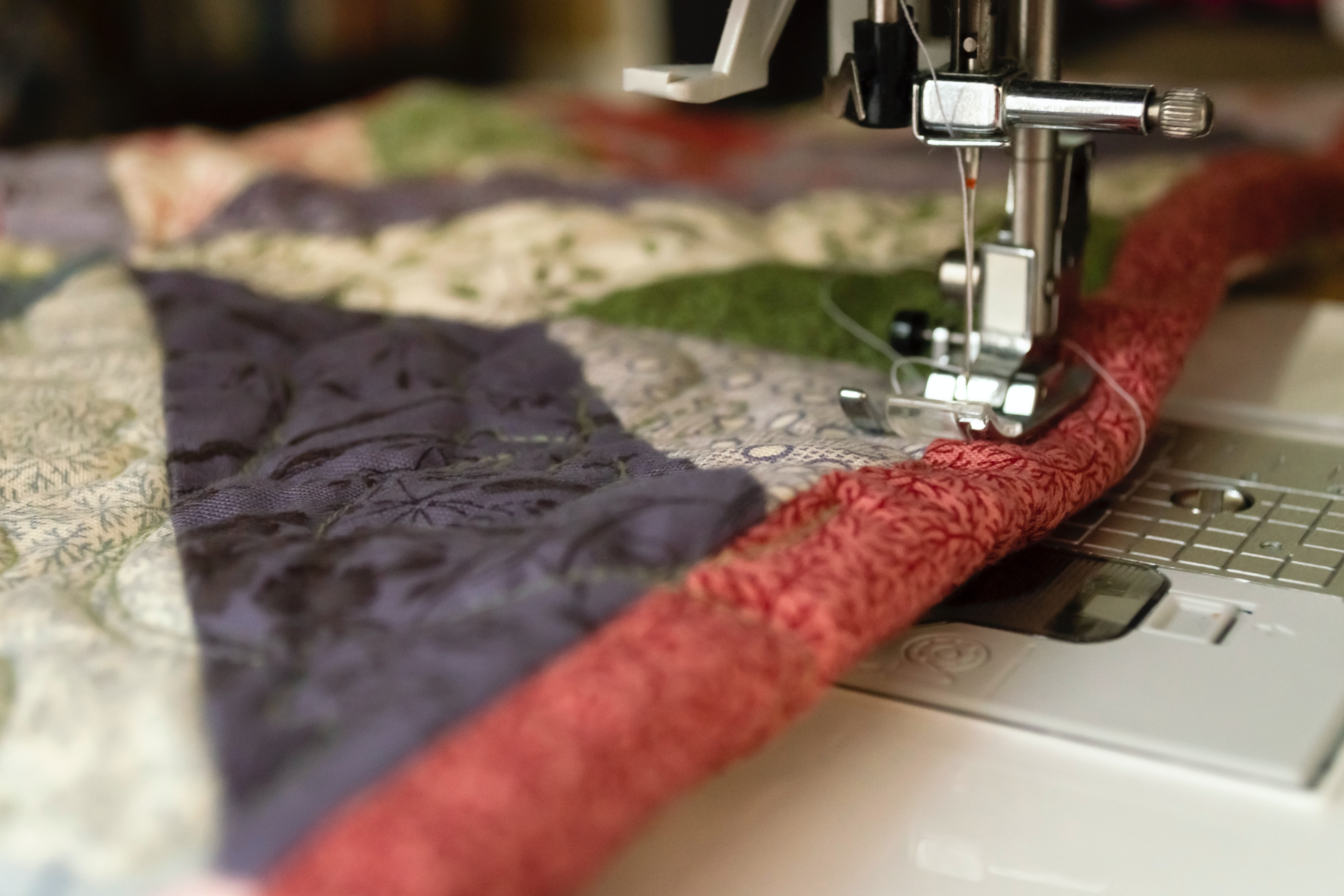 needle sewing a quilt