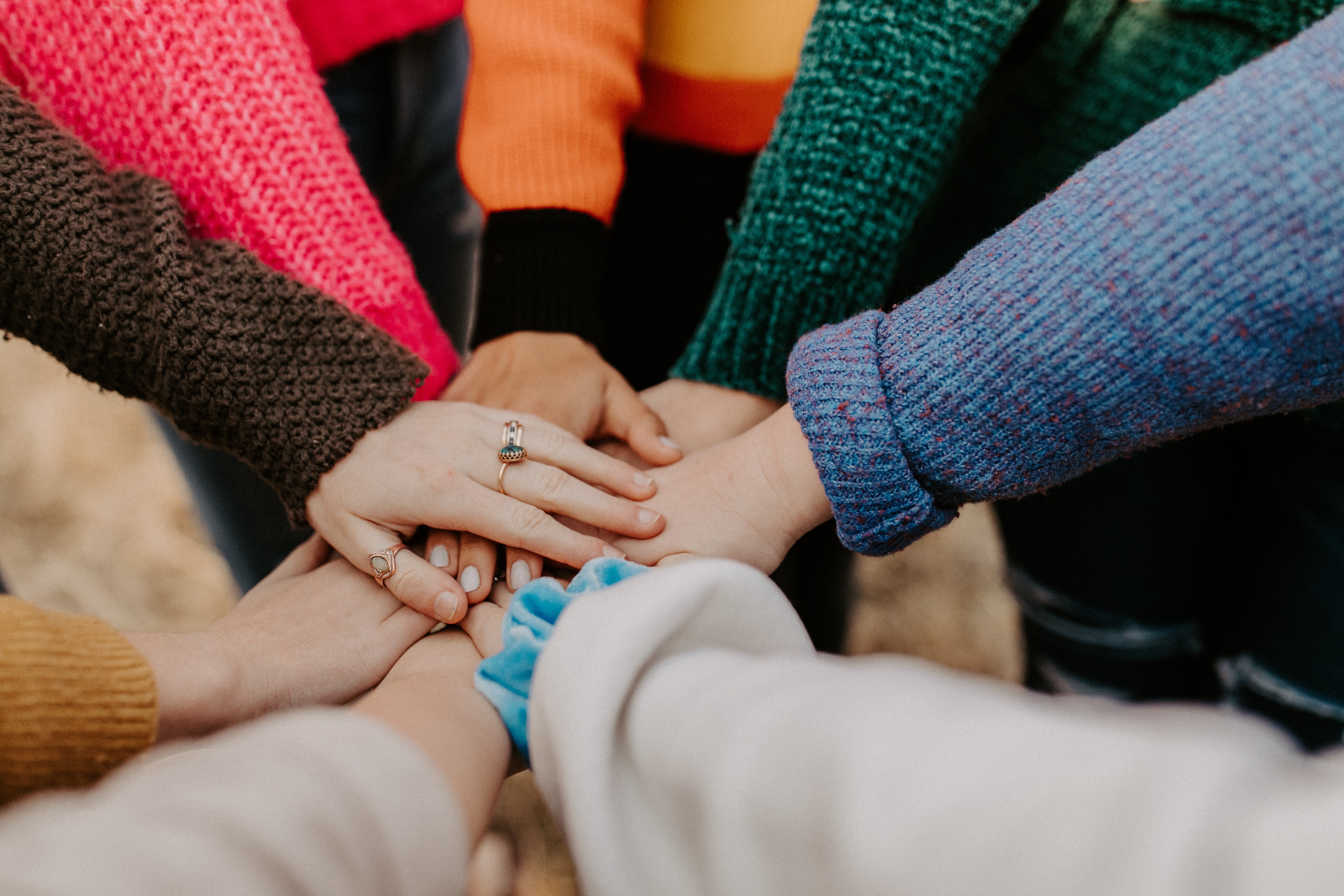 hands grouped in a circle