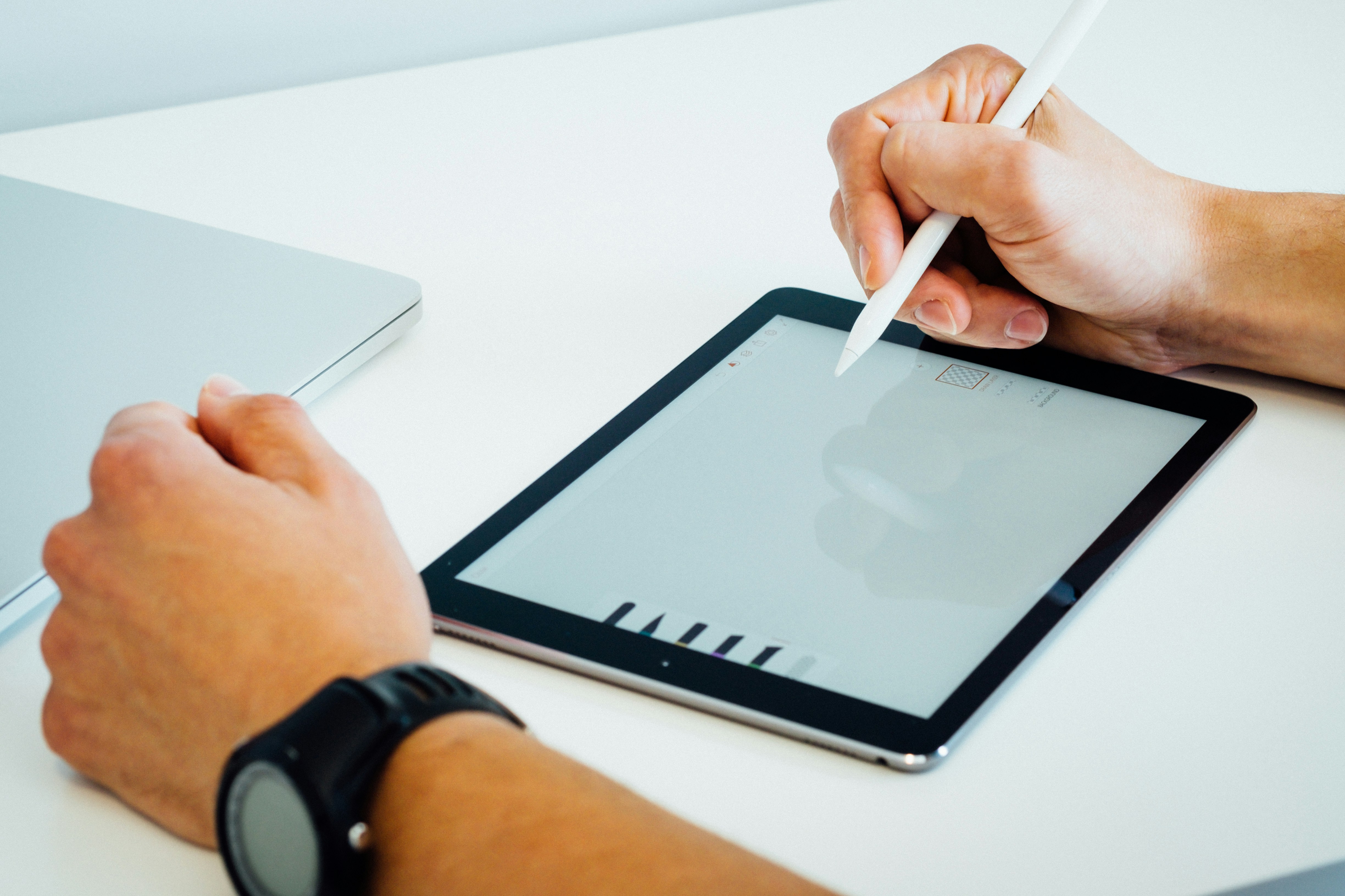Person using a tablet with a digital pen