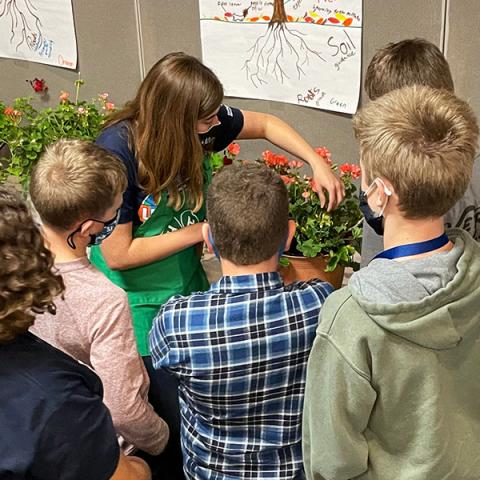 Kids learning about plants at leadership conference