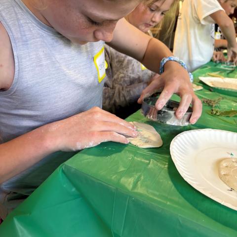 Youth working with clay