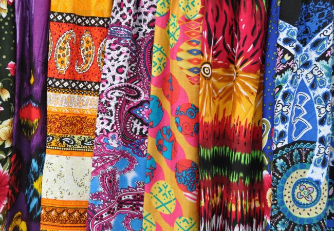 variety of fabrics with bright patterns on them