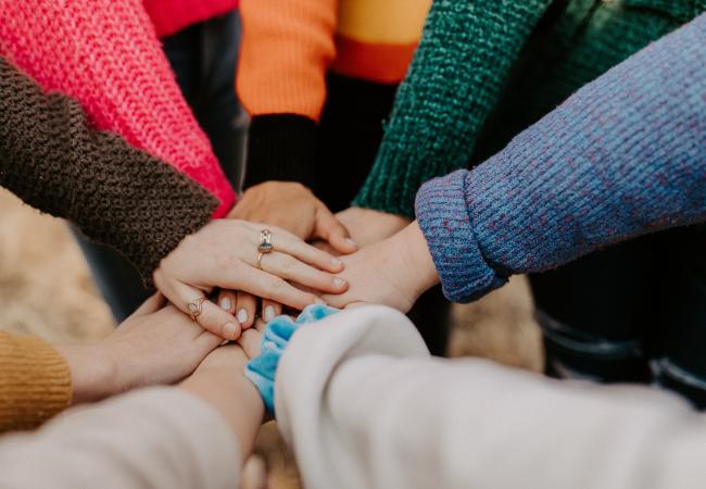 hands grouped in a circle