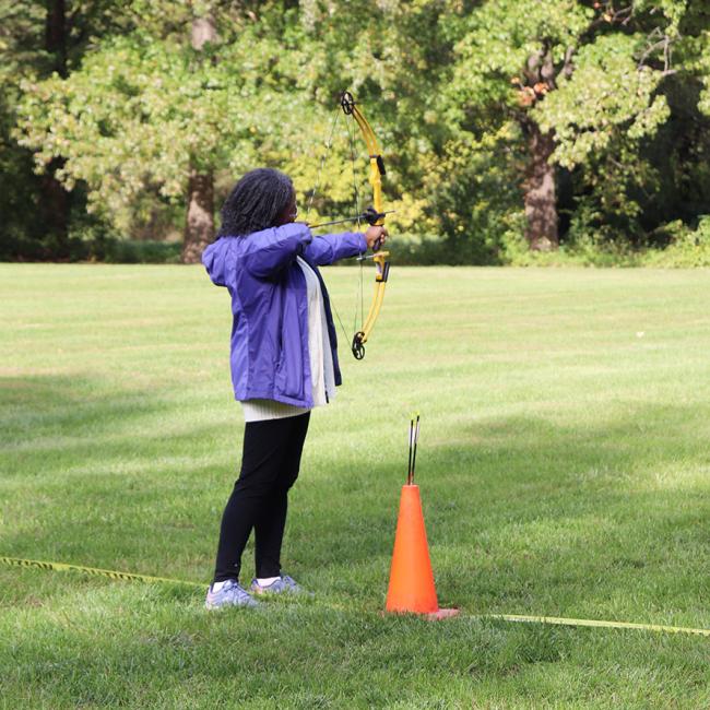 woman shooting bow