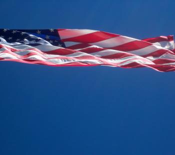 Citizenship - flag blowing in wind
