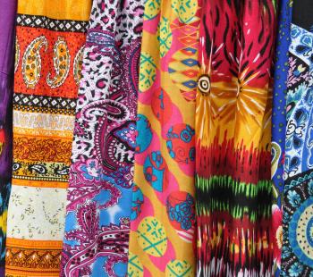 variety of fabrics with bright patterns on them