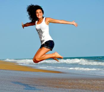 girl jumping and smiling