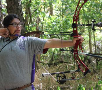 Teen with a bow and arrow