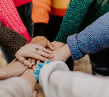 hands grouped in a circle