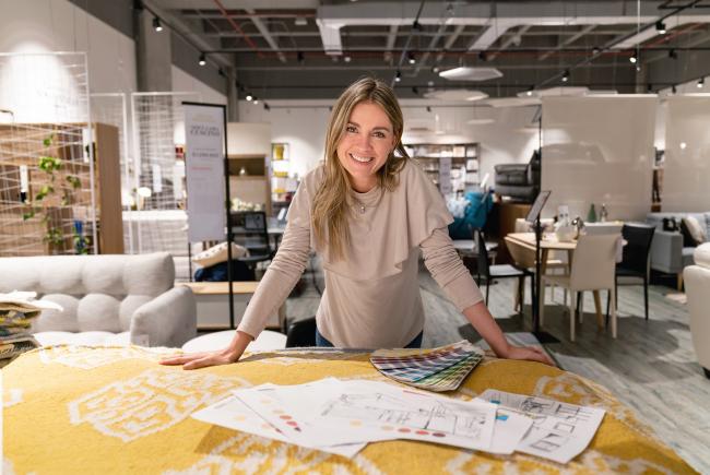 woman in interior design showroom with samples on table