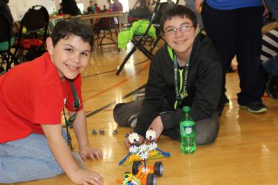 2 boys doing robotics